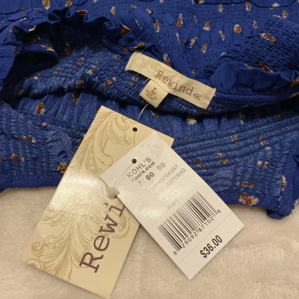 Rewind Royal Blue Sleeveless Floral Blouse with Patterned Hem